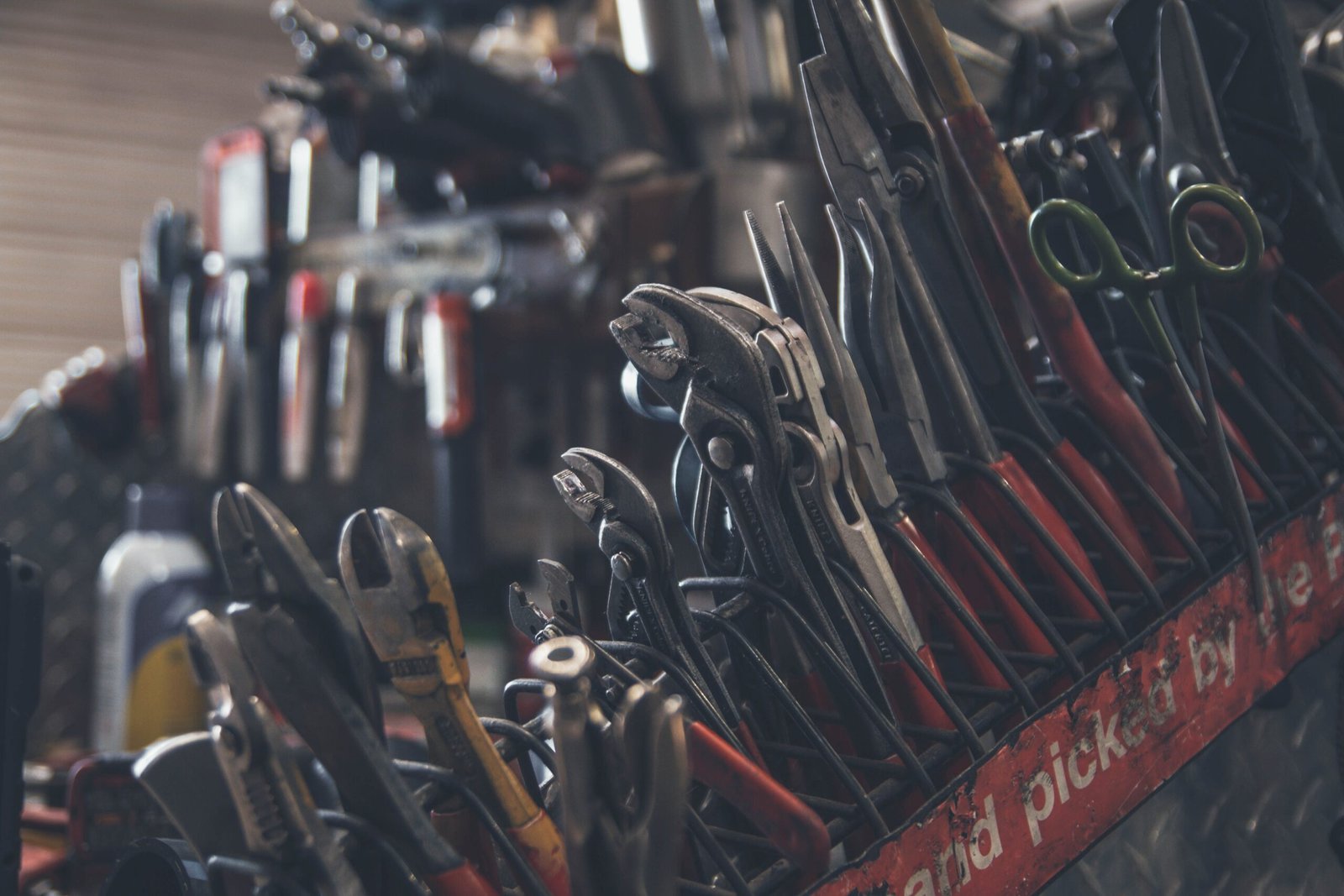 selective focus photography of mechanics tool lot